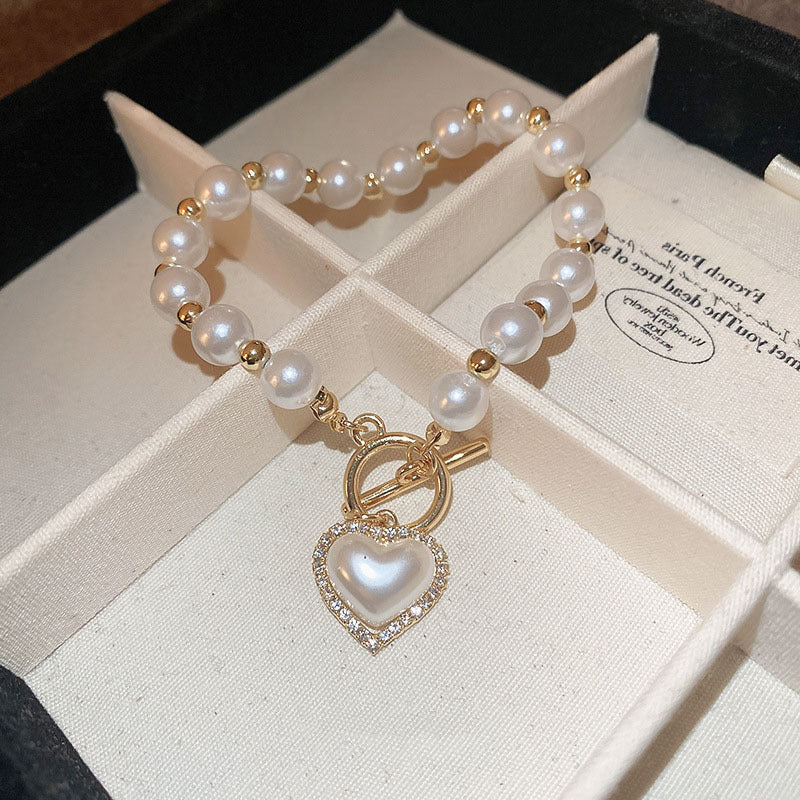 Bracciale con cuore di perle e fibbia con diamanti