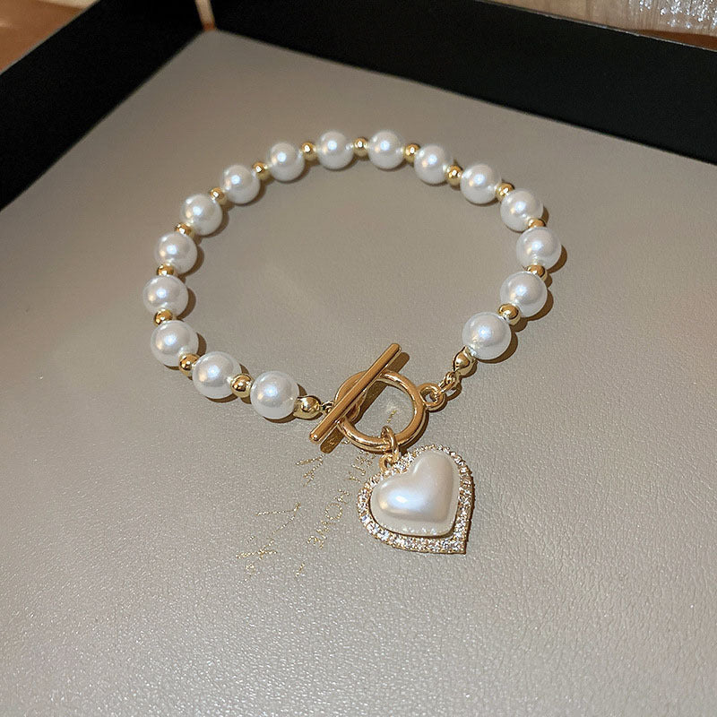 Bracciale con cuore di perle e fibbia con diamanti