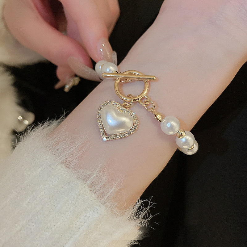 Bracciale con cuore di perle e fibbia con diamanti