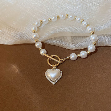 Bracciale con cuore di perle e fibbia con diamanti