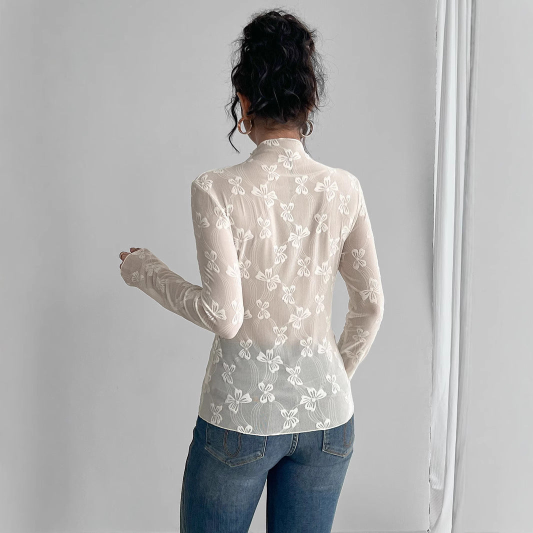 Maglia trasparente bianca con farfalle ricamate