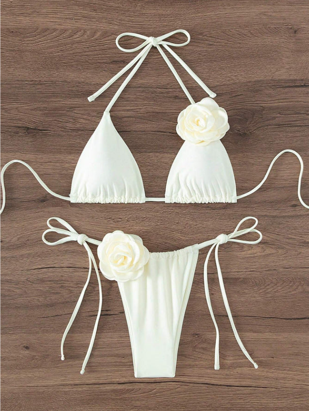 Swimsuit with three-dimensional flower.